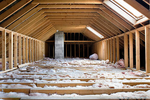 Unfinished attic with floor insulation installed in Norwalk, CT.