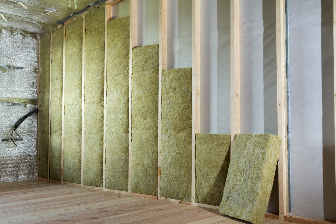 Wall without drywall displaying the installed sheets of insulation in Norwalk.